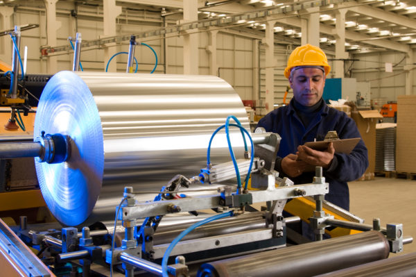 Steel factory worker at work